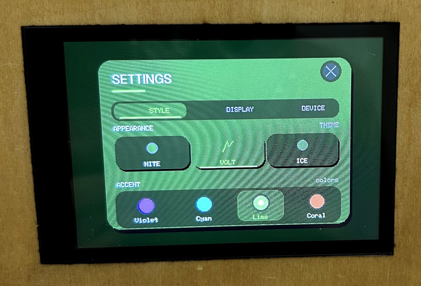Close-up of NT-01 settings screen with theme and accent picker